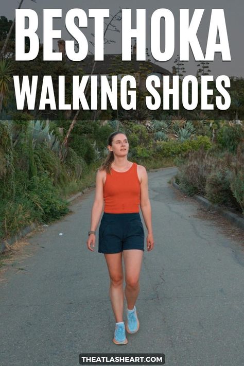 A young woman wearing light blue Hoka walking shoes, an orange tank top, and navy shorts walks towards the camera on a paved path lined by succulents and bushes, with the text overlay, "Best Hoka Walking Shoe." Hoka Walking Shoes Woman, Hoka Bondi 8 Women Outfit, Hoka Shoes Woman Outfit, Hoka Outfit, Hoka Shoes Woman, Walking Sneakers For Women, Shoes For High Arches, Best Shoes For Travel, Waterproof Walking Shoes