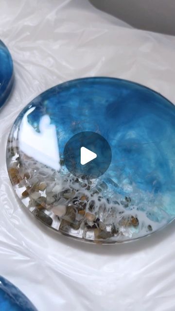 Craft Resin Epoxy - The Clear Choice for Artists & Crafters on Instagram: "🌊✨ DIY Ocean-Inspired Resin Coasters Tutorial! 

In this video, our talented artisan @anastasia_kate_art takes you through a step-by-step tutorial on creating stunning ocean-themed coasters using 1:1 @craft.resin 

🔹 Step 1: She starts by mixing the resin in equal parts. 
🔹 Step 2: Next, she pours the resin into the mold and adds decorative elements like small stones for that perfect beachy vibe. 
🔹 Step 3: A touch of white pigment is added to create beautiful wave effects.

Watch till the end to see the breathtaking final result! 🌟 

Use code ANASTASIA10 to get 10% off at craft-resin.com 

Don’t forget to like and share if you love these coasters as much as we do! 💙

 #ResinArt #DIYCoasters #CraftResin #Ocean Ocean Coasters Resin, Small Epoxy Projects, Diy Resin Coasters, Craft Resin, Resin Coasters, Diy Coasters, Resin Tutorial, Instagram Diy, Ocean Inspired