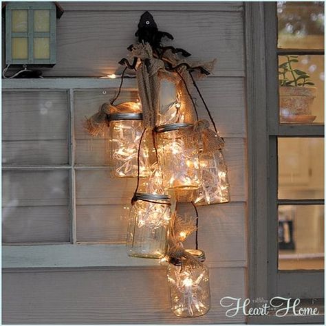 Light up your backyard with Mason jars stuffed with white string lights. Hung on the side of your home, this chandelier-style lantern creates the perfect mood for relaxing under the stars.