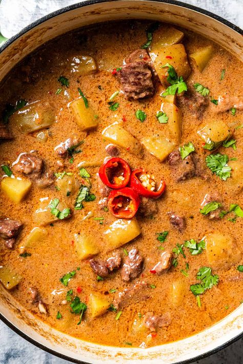 This beef Massaman curry made from scratch is pure comfort food. The rich, fragrant Thai curry is slow-cooked with tender beef chunks, potatoes, smoky chilies, and creamy coconut milk until the meat is tender and the sauce is flavorful. #massaman #thai #curry Beef And Potato Curry, Massaman Beef Curry, Thai Massaman Curry Recipe, Curry Beef Recipes, Masman Curry, Massaman Curry Chicken, West Indian Curry, Beef Curry Recipes, Minced Beef Curry