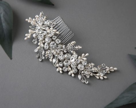 Glamorize your special day with this radiant sparkling wedding hair comb with pearl drops. Reminiscent of a fairy-tale dream, this elegant comb features round and marquise cut crystal stones, delicately accented with ivory pearl drops and crystal-dotted leaves, creating a timelessly mesmerizing effect. Perfect for the modern bride looking to add a touch of elegance and refinement to her look. This side comb measures about 6 inches long and 2 inches high. . #bridalhaircomb #bridalhaircombs #b... Pearl Hair Piece, Sparkling Wedding, Side Comb, Gold Headpiece, Wedding Hair Comb, Sparkle Wedding, Bridal Comb, Vintage Inspired Jewelry, Headband Tiara