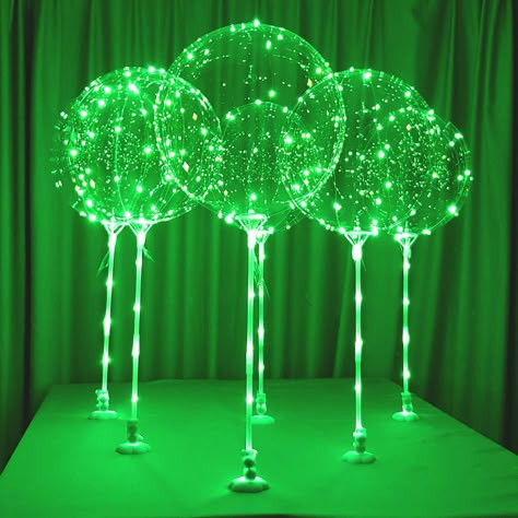 PRICES MAY VARY. [No Helium required] Balloons with sticks can stand up straight around 30-35 inches supported by white base holders that the balloon sticks can fit into. Double-side adhesive stickers are provided to fix the base holders s to a solid surface. [Long LED string lights] for each balloon, light up string lights around 10 foot (300cm) long of a green color. The LED string light can tread through the balloon sticks then wrap around the clear balloons and can be easily tied. Green colo Clear Balloon, Light Up Balloons, Alien Party, Halloween Party Balloons, Led Balloons, Clear Balloons, Room Green, Up Balloons, Balloon Pump