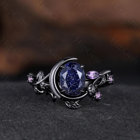 Blue Sandstone Engagement Ring, Unique Ring for Her, Gothic Black Gold Ring for Women, Moon Style Weeding Ring Main Stone: 6x8mm Oval Cut Blue Sandstone. Side Stone: Amethyst Band Width: Approx. 1.6mm Our Services: All sizes are available, if you need other ring sizes, please feel free to contact me. Production Time: Since all rings are handmade according to orders, it takes about 13-15 working days (excluding weekends) to make, and 3-5 working days to arrive, thank you for your understanding. Expedited Order: We provide expedited order service, it takes about 7-10 working days (excluding weekends) to complete the ring, and 3-5 working days to arrive, if you are in a hurry to get the ring, please contact me. Payment Plan: We offer payment plan, you can pay weekly or monthly, we will keep t Engagement Ring Star, Engagement Rings Unique Non Traditional, Acotar Engagement Ring, Engagement Rings Moon, Celestial Oval Sapphire Ring Gift, Fairy Engagement Rings, Ring Designs Engagement, Celestial Moon-shaped Moonstone Wedding Ring, Blue Celestial Rings With Accent Stones