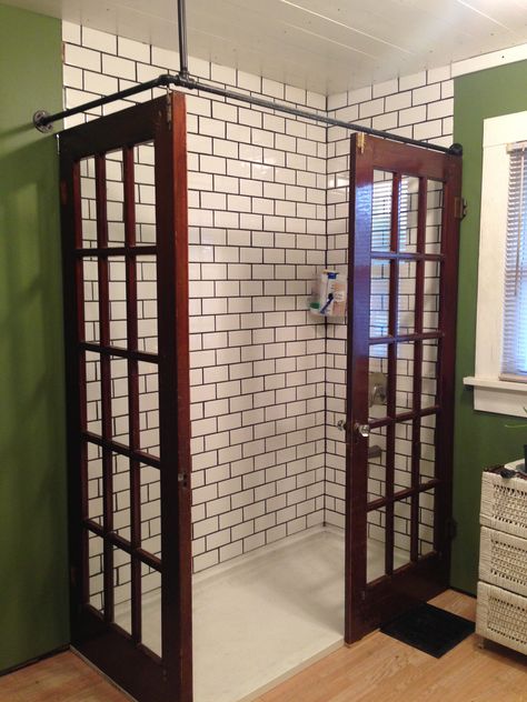 Our 2020 walk in shower remodel using repurposed French doors. French Door To Bathroom, Repurposed Shower Doors, Repurpose French Doors, French Door Shower Doors, Repurposed French Doors, Bathroom With Door To Outside, Walk In Shower No Door No Glass Ideas, Diy Shower Door Ideas, Basement Shower Ideas