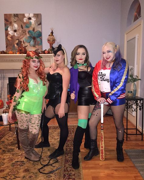 Gotham city costume. Poison ivy, cat woman, the joker, and Harley Quinn take on the world. Group costumes Dc Trio Costumes, Joker Group Costume, Hero And Villian Costume, Trio Halloween Costumes Villains, Dc Villain Costumes, Cat Woman And Poison Ivy Costumes, Héros And Villians Costume Ideas, Dc Group Costumes, Trio Halloween Costumes Joker