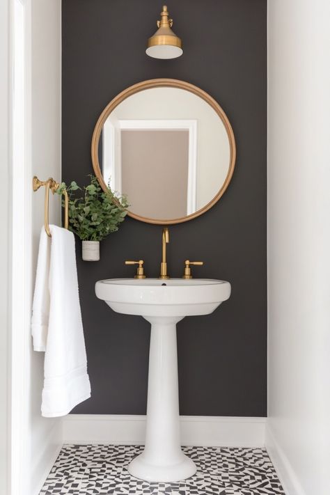 Design the perfect small moody bathroom space with these decor ideas. Dark Moody Small Bathroom Ideas, Colonial House Interior Design Bathroom, Small Bathroom With Dark Walls, Small Half Bath Paint Ideas, Gray Cabinet Bathroom Ideas, 1920s Powder Room, Small Powder Room Decorating Ideas, Small Powder Room With Pedestal Sink, Power Bathroom Ideas