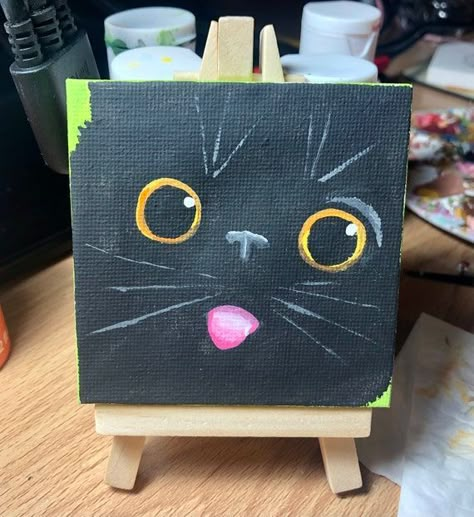 Black Cat Face With Tongue Out 3x3inch CanvasEtsy Black Cat Aesthetic Painting, Black Canvas Art Ideas Paint, Cat Drawing Canvas, Black Cat Canvas Painting Easy, Mini Canvas Cat Painting, Simple Black Cat Painting, Cute Black Cat Painting, 2 Cats Painting, Black Cat Painting Acrylic Easy