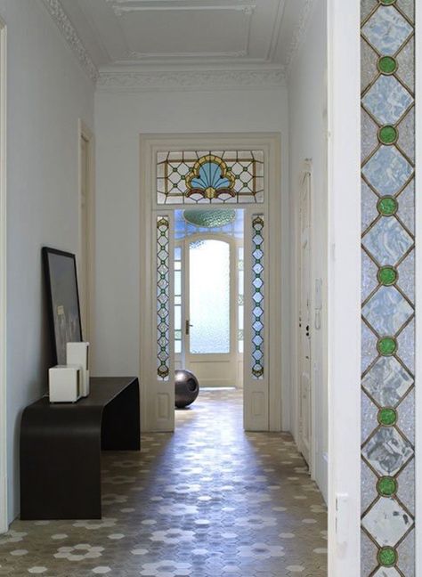 Founded in 1999 by Elina Vila and Agnés Blanch, Minim is an interior design studio focused on "maximizing the potential of each space, keeping all tho Pearl House, Entrance Halls, Stained Glass Door, Inspiring Interiors, Transom Windows, Blue Lilac, Entrance Ways, Glass Work, Compact Living