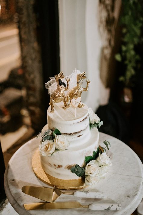 Semi-Naked Wedding Cake With Gold Dinosaur Cake Toppers | By Anais Possamai | Brooklyn Elopement | Intimate Wedding | Small Wedding | Contemporary Wedding | Bridal Boots | First Look | bridal Two Piece | Peacock Chair Wedding Decor | Semi-Naked Wedding Cake | Red Wedding Flowers | Elopement Wedding Dinosaur Wedding Cake Topper, Dino Wedding Cake, Peacock Chair Wedding, Gold Dinosaur Cake, Dino Wedding, Bridal Two Piece, Dinosaur Wedding Cake, Brooklyn Elopement, Wedding Contemporary