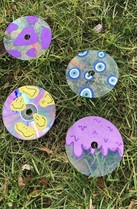 These cds are hand painted and selling on my etsy! click link if interested your support means a lot ✨✨ #smallbusinessowner #indie #indieroomdecor #etsyseller #etsyshop #etsyfinds #aesthetic #y2kaesthetic #supportsmallbiz #etsygifts #cheaphomedecor #indieart #aestheticroomdecor #checkitout #trendy #trends #art #grunge Painted Cds Grunge, Painted Cds, Cd Wall Art, Cd Wall, Cd Painting, Cd Decor, Beautiful Bedroom Designs, Room Decor Aesthetic, Cd Art