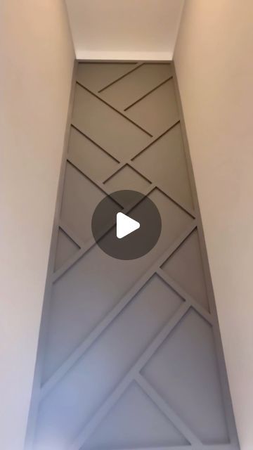 Trim Depot - Ontario’s Leading Trim & Door Supplier on Instagram: "Don’t let your stairwells go unnoticed! We’re adoring this feature wall from @theboardroomaccentwalls🙌 Make your stairwell have a grand effect in your home! Re-create this look using our flat stock. ➡️FOLLOW US for more home inspo ➡️VISIT our showroom to get inspired ➡️SAVE and SHARE for later • • • #trimcarpentry #trimcarpenter #trimwork #interiordesign #interiordesigner #baseboard #interiorrenovation #renovation #homeinspo #homeinspiration #crownmoulding #wainscoting #featurewall #accentwall #modernbaseboard #wallpanel #wallpanelling #slatwall #panelmoulding #waffleceiling" Herringbone Wall Panel, Triangle Wall Panelling, Stairs Wall Panelling Design, Wall Stairs Design, Wood Feature Wall Bedroom Herringbone, Wooden Wall Panelling Stairs, Wayne Scotting Walls, Stairwell Wall Ideas, Basement Stairwell