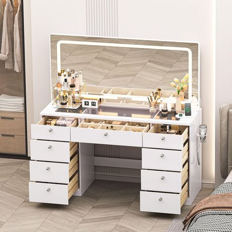 PRICES MAY VARY. 46 INCH MAKE UP DESK Measuring 46.1 inches (L) x 15.8 inches (W) x 55.1 inches (H), this vanity unit has a clear glass table top [46.1 inches (L) x 15.8 inches (W)] with a large mirror to meet all the make-up needs of girls and women LIGHTS ADJUSTABLE Our vanity desk has 3 different colors of light for you to choose from (cold white, warm white, warm yellow) to make you look beautiful easily MULTIFUNCTIONAL TABLE We've designed a charging station and USB port on the desktop for Long Vanity Desk, Small Room Vanity, Vanity Table Ideas, Table With Lights, Vanity Table With Lights, Desk For Bedroom, Glass Top Vanity, Modern Dressing Table Designs, Vanity Desk With Mirror