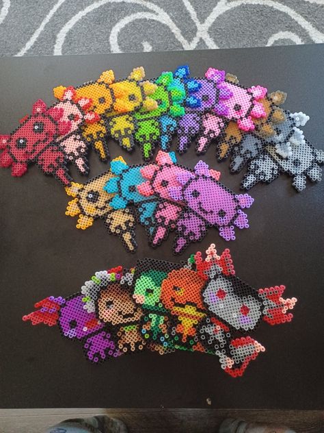 Every axolotl I've created Perler Axolotl, Axolotl Bead Pattern, Axolotl Perler Bead Patterns, Axolotl Perler Beads, Axolotl Pixel Art, Alt Crafts, Axolotl Party, Mini Hama Beads, Bead Animals