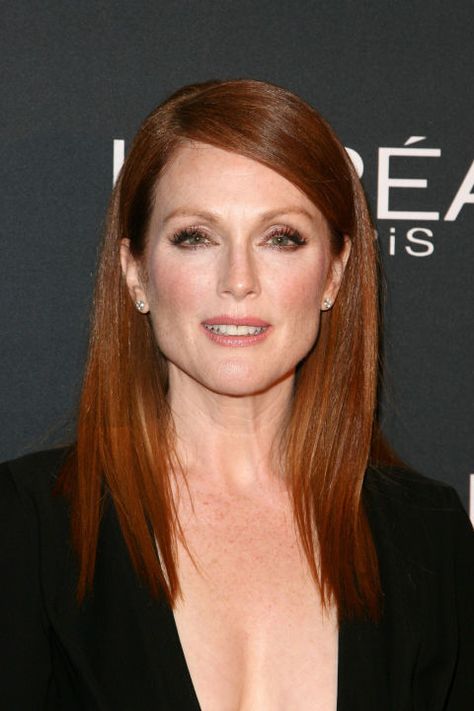 The 56-year-old redhead told People that "it's a privilege to age." But her deep part and sleek, pin-straight hair (styled with the help of a straightener) help her look timeless. Red Hair Celebrities, Hair Color For Women, Julianne Moore, Star Hair, Auburn Hair, Celebrity Hairstyles, Pretty Hairstyles, Cannes, Redheads