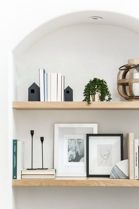 When we bought our house, these archways were here but nothing was in them. They were wasted space and looked awkward in the living room. I had my contractor build floating shelves and custom cabinetry and now they are my favorite feature in this room! Photo by @public311design #shelves #shelves #shelfie #shelfdecorating #interiordesignideas #interior #interiordesignlivingroom Minimalist Shelves Decor, Floating Shelves Living Room, Minimalist Shelves, Floating Shelf Decor, Shelf Decor Living Room, Styling Shelves, Mediterranean Style Home, Bookshelf Styling, Decorating Shelves