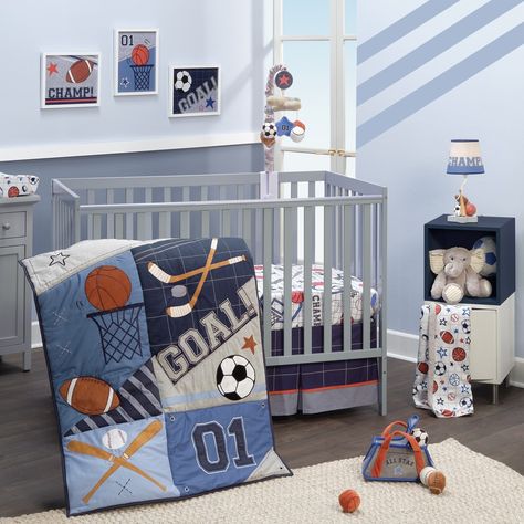 Your little one will sleep like an all-star with this custom designed sports theme crib bedding set. The three-piece set includes one quilt, one breathable 100% cotton fitted crib sheet, and one crib skirt. The patchwork style quilt, which is completely appliqued and embroidered, includes textured fabrications of heather gray chambray, velour, and faux suede. Featured sports include basketball, football, baseball, hockey, and soccer. The back of the quilt is a navy and gray windowpane pattern. T Sports Nursery, Basketball Baby, Lambs & Ivy, Baby Crib Bedding Sets, Blue Bedding Sets, Baby Crib Bedding, Fleece Baby Blankets, Bedding Sets Online, Baby Crib Mobile