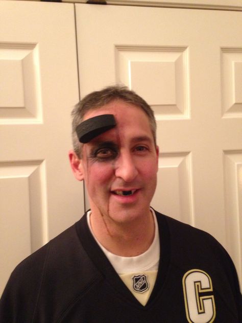 Hockey player puck in forehead.   Tips: foam puck curved to head. Use double stick Velcro and stick to clean (wipe with alcohol) skin. Double stick Velcro worked much better than spirit glue which was too runny. Zombie Hockey Player Costume, Ty Costume, Puck Costume, Hockey Halloween Costume, Hockey Costume, Hockey Player Costume, Hockey Halloween, Jack Halloween, Sports Costume