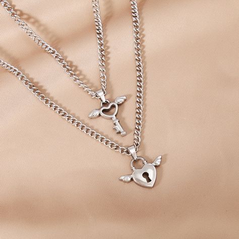 Classification 
						 Pendant Necklace 
					 
 
						 Color 
						 Silver 
					 
 
						 Gender 
						 Couple 
					 
 
						 Material 
						 Stainless Steel 
					 
 
						 Occasion 
						 Holiday, Party, Street 
					 
 
						 Pattern 
						 Heart Shape 
					 
 
						 Quantity 
						 1 Set 
					 
 
						 Style 
						 Streetwear 
					 
 
						 Weight 
						 26g Love Necklace Couple, Wings Decor, Necklace Couple, Key Lock, Color Plata, Stainless Steel Pendant, Style Streetwear, Love Necklace, Stainless Steel Necklace