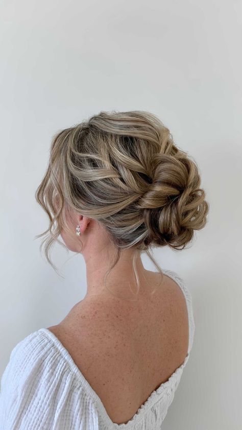 Low Messy Bun Wedding Hair Loose Curls, Messy Curly Bun Wedding, Grad Updo Hairstyles, Prom Updos Bun, Low Messy Bun Prom Hair, Deb Hairstyles Bun, Debs Hair Updo, Low Messy Wedding Bun, Hair For Bridesmaids Updos