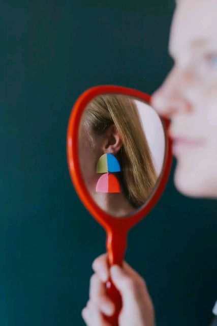 Made by Maeberry on Instagram: "An ode to "The Dua". One of the most versatile earrrings in the shop, you can mix and match sets to coordinate with your outfits. Photography: @anchoredimage Model: @dannaleethal" Colorful Earrings Aesthetic, How To Photograph Earrings, Color Block Earrings, Earings Photography Idea, Clay Earrings Photography, Colorful Jewelry Photography, Earrings Product Photography, Earrings Photoshoot Ideas, Earring Photography Ideas