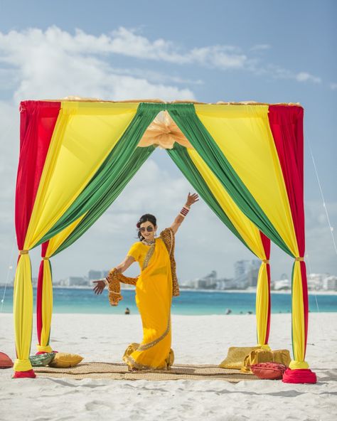 Dolly posing in her reggae inspired decor for her haldi ceremony on the beach in Cancun Mexico. Destination Wedding. JSK Photography Jamaican Wedding Ideas, Jamaica Facts, Rasta Wedding, Jamaica Party, Jamaican Party, Jamaican Clothing, Caribbean Carnival Costumes, Haldi Decoration Ideas, Jamaican Colors