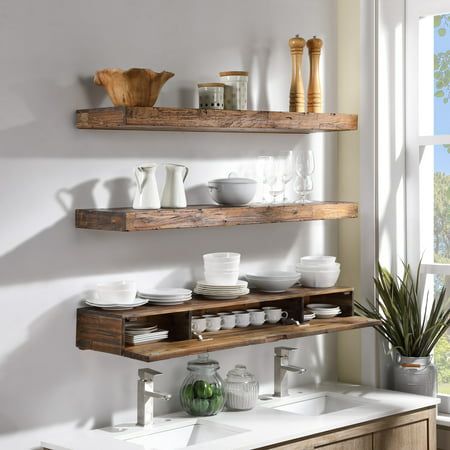 Stylize your kitchen with these decorative but functional floating wall shelf. Deep enough to showcase ceramic ware, the thick distressed wood design makes this piece both visually substantial and structurally rigid. A concealed internal compartment can store teas, tools, and more. Installation is very easy, and includes a french cleat. Made from quality Acacia hardwood, this unit will make a great highlight piece for your kitchen. Color: Brown. Bathroom Rustic Shelves, Kitchen Sink Open Shelving, Farmhouse Shelf Decor Kitchen, Lights Over Floating Shelves Kitchen, Reclaimed Wood Kitchen Shelves, Rustic Floating Shelves Kitchen, Open Shelving In The Kitchen Wall Shelves, Floating Shelves In The Kitchen, Wooden Floating Shelves Kitchen