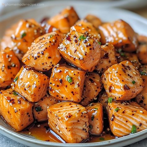 Air Fryer Salmon Bites are crispy on the outside, tender on the inside, and finished with a drizzle of sweet and spicy hot honey. These bites are perfect as an appetizer or main dish. Hot Honey Drizzle, Hot Honey Salmon Air Fryer, Air Fryer Salmon Bites With Hot Honey, Honey Garlic Salmon Bites Air Fryer, Salmon Bits In Air Fryer, Salmon Bites Appetizers, Recipes Using Hot Honey, Hot Honey Recipe Ideas, Salmon Bites Recipe Air Fryer