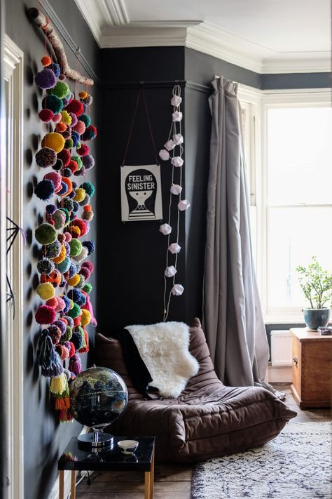 This bold home is full of DIY ideas and one of a kind crafts and decor items. We love the dark black wall in the bedroom, the organized open shelving in the kitchen and the contrast between the tile and wallpaper in the bathroom. Artist House Interior, Artistic House, Pompom Decor, Quirky Decor, Dark Walls, Quirky Home Decor, Decoration Originale, Artist House, Paper Artist