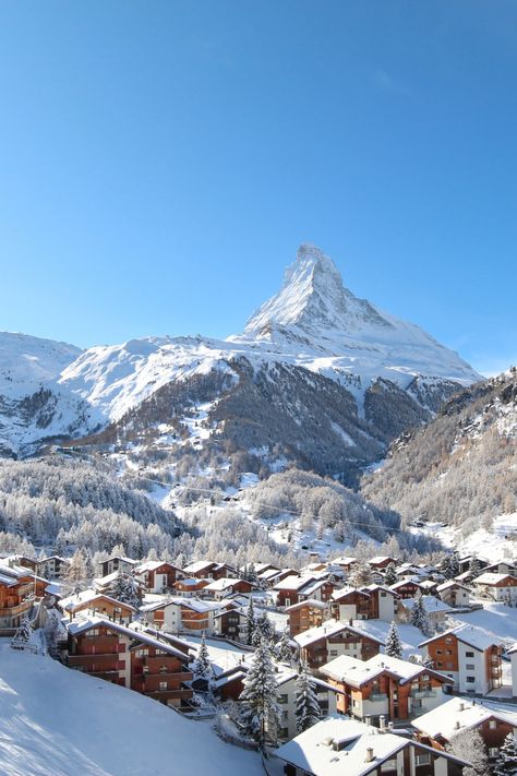 Snow-covered chalets in front of the Matterhorn Ski Resort Switzerland, Switerzerland Honeymoon, Switzerland Alps Winter, Skiing In Switzerland Swiss Alps, Geneva Switzerland Christmas, Switzerland In The Winter, Zurich Switzerland Christmas, Switerzerland Summer, Zermatt Aesthetic