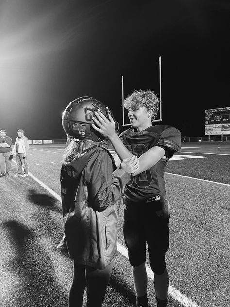 Football, girlfriend where’s helmet, and on the field after a game. Boyfriend Football Pictures, Pics With Football Boyfriend, Girlfriend Supporting Boyfriend Football, Supportive Gf Athletic Bf, Boyfriend Girlfriend Football Pictures, Football Boyfriend And Girlfriend, Gf Wearing Bf Football Jersey, Girlfriend Wearing Boyfriends Jersey, College Football Boyfriend