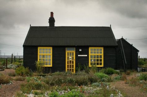 10 Things Nobody Tells You About Painting the Exterior of Your House Black House With Yellow Door, Small Black House, Prospect Cottage, Derek Jarman, Black Cottage, Black Houses, Paint Your House, Dark House, Yellow Doors