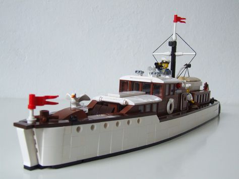 https://flic.kr/p/r8izdJ | Yacht "Sirius" | A 60 studs commuter yacht of the "Roaring Twenties" with a combination of PF and 9V lighting. Beam: 12 studs. 100% Lego.  Strongly inspired by Joshua's (JBIronWorks') amazing commuter yacht "Mohican", see <a href="https://www.flickr.com/photos/95309146@N06/15357970010/">www.flickr.com/photos/95309146@N06/15357970010/</a> Lego Yacht, Lego Movie Sets, Lego Boat, Lego Creator Sets, Lego Decorations, Lego Club, Micro Lego, Lego Boards, Lego Ship