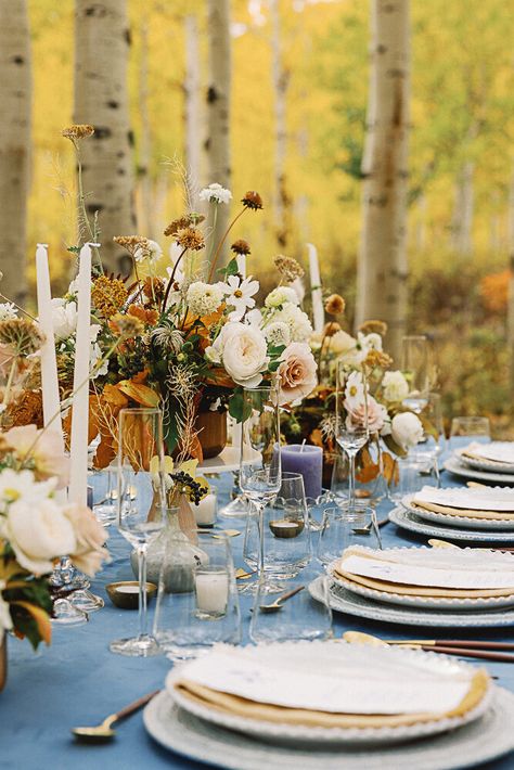 Stacked plates on a wedding table with blue table cloth, gold flatware, foraged flowers, and candles Montana Fall Wedding, Fall Vermont Wedding, Fall Wedding Table Ideas, Wedding Ideas Elopements, Fall Colorado Wedding, Colorado Fall Wedding, Fall Leaf Wedding, Harvest Wedding, Autumn Wedding Ideas