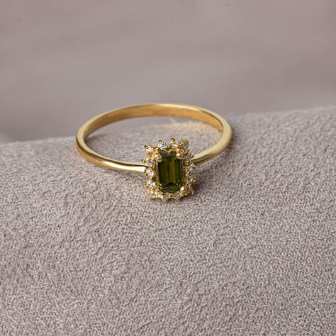 With its shimmering pale green color, peridot stone is also known as the "evening emerald". It is a gemstone often associated with spirituality and expression. Our rectangular peridot stone ring surrounded by real diamonds will add elegance to your hands. It is a ring that you can use both on special occasions and in daily life. It is a beautiful and stylish product that you can gift to yourself and your loved ones. The color of those born in August is Peridot. Our necklace compatible with our r Diamond And Peridot Engagement Rings, Ring With Green Stone, Peridot Birthstone, Woman Jewelry, Peridot Jewelry, Peridot Stone, Jewelry Lookbook, Peridot Ring, Peridot Gemstone