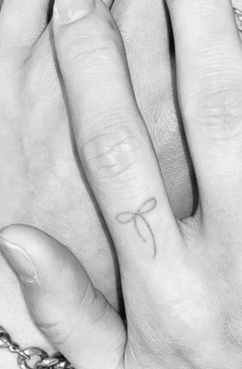 #bow #finger #tattoo Aesthetic Bow Tattoo, Tattoo On Inside Of Finger, Bow Finger Tattoos For Women, Minimalist Bow Tattoo, Fairy Finger Tattoo, Bow Tattoo On Finger, Bow On Finger Tattoo, Bow Hand Tattoo, Bow Tattoo Finger