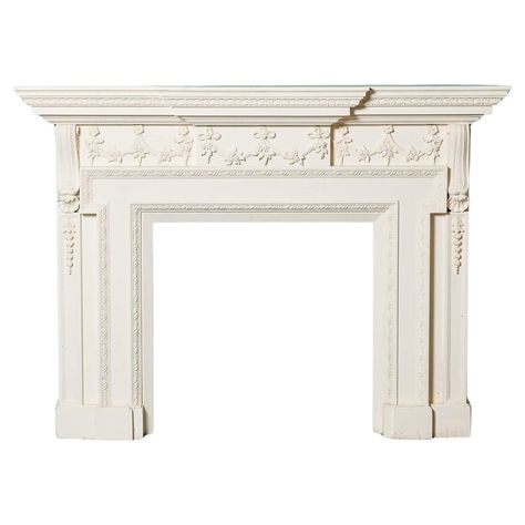 A large antique neoclassical wooden fireplace. This impressive, large scale fire surround is crafted in hardwood and ornately decorated with composition embellishments, including floral carvings and swags to the frieze and central tablet. The corbels, thick jambs, and protruding mantel instil this surround with a unique look and neoclassical flair; the perfect feature for traditional and modern interiors alike. Additional dimensions Opening Height 82cm (32.28in) Opening Width 83.5cm (32.87in) Ba Luxury Fireplace, Antique Fireplace Mantels, Wooden Fireplace, Fire Surround, Antique Fireplace, Garden Elements, Marble Fireplaces, Antique Paint, Modern Interiors