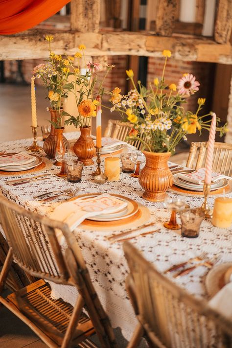 Retro orange wedding inspiration using patterned and textured candles, orange and yellow wedding flowers and more Vintage Boho Wedding Table Settings, 70s Wedding Table Decor, 60s Wedding Theme Vintage, 1970s Inspired Wedding, 1970s Wedding Decor, Mcm Wedding Decor, 60s Table Decorations, 70s Table Decor, Retro Garden Party