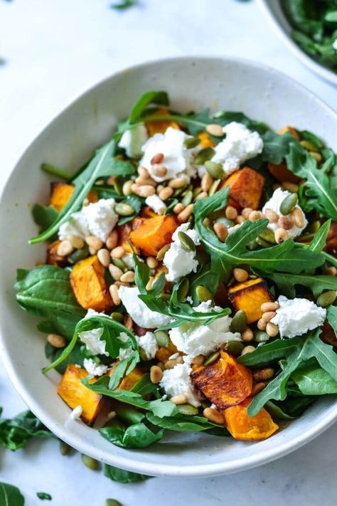 Sweet, caramelised roasted pumpkin is tossed together with lovely soft and creamy goats cheese and peppery rocket. The salad is then tossed together with some crunchy, earthy roasted pine nuts, pepitas and a dash of olive oil. The perfect combination of textures and flavours! Whenever I get asked to "bring a salad", this is my go-to salad recipe! #pumpkinsalad #pumpkinsaladrecipeshealthy #pumpkinsaladrecipe #pumpkingoatscheesesalad #easysaladrecipe #christmassalad #holidaysalad Salads For Picnics, Roast Pumpkin Salad, Pine Nuts Salad, Pine Nut Recipes, Pumpkin Salad, Cold Lunches, Goats Cheese, Roasted Pumpkin, Goat Cheese Salad