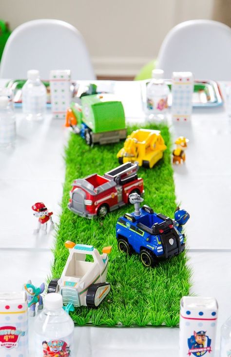 Adorable party table centerpiece with "grass" and vehicles from a Chic Paw Patrol Birthday Party at Kara's Party Ideas. See all the pawsome details at karaspartyideas.com! Magnatiles Ideas, Paw Patrol Birthday Party Ideas, Paw Patrol Centerpiece, Paw Patrol Birthday Cake, Party Table Centerpieces, Faux Grass, Birthday Party Centerpieces, Patrol Party, Paw Patrol Birthday Party