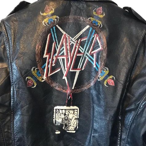 Ghost Town Vintage on Instagram: “Authentic 1980s Slayer black leather battle jacket. Hand painted Pentagram and sword logo on the back in pristine condition.  It even has…” Paint Leather Jacket, Leather Battle Jacket, Jacket Back Patch, Jacket Hand Painted, Battle Jackets, Battle Vest, Painted Leather Jacket, Battle Jacket, Painted Jacket