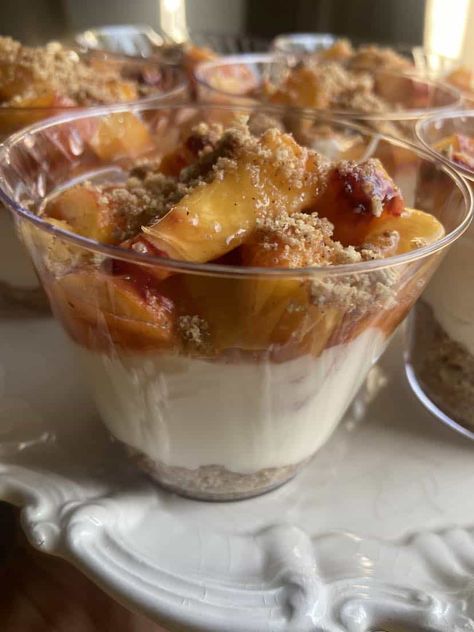 No Bake Peach Cheesecake Cobbler - FlyPeachPie No Bake Peach Cobbler, No Bake Peach Cheesecake, Cheesecake In A Cup, Cheesecake Cobbler, Peach Cobbler Cheesecake Recipe, Mini Peach Cobbler, Peach Cobbler Cheesecake, Cheesecake Shooters, Peach Cheesecake