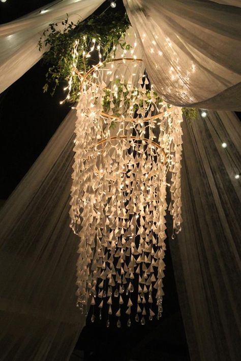 DIY Hoola Hoop, icicle lights, wax paper, greenery, chandelier Hula Hoop Greenery Chandelier, Wedding Icicle Lights, Diy Chandelier Party Decoration, Diy Chandelier For Wedding, Hoola Hoop Lights Diy Chandelier, Hula Hoop Chandelier Wedding, Hoola Hoop Wedding Decoration, Hoola Hoop Chandeliers, Diy Chandelier Wedding