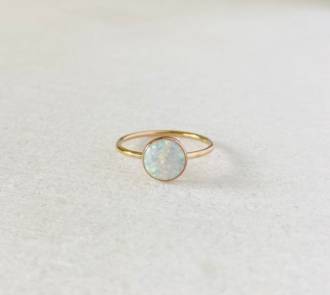 This ring comes with a large man made 8mm sparkling white opal. Available in gold filled, sterling silver or 14k solid yellow gold. Band: 1.3mm Opal is October birthstone. Solitaire Opal Ring, White Gold Opal Ring, Gold Ring Band, Birthday Gemstones, Opal Stacking Ring, Opal Solitaire Ring, Solid Gold Charms, Dot Ring, Ring Man