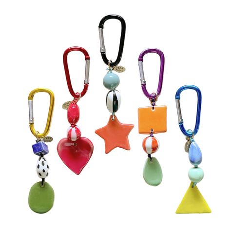 One of a kind bag charms are here! What a fun way to add a pop of color to your outfit. All the styles listed are one of a kind. approx. 6.5" long, sometimes a little longer. made with ceramic beads (Please handle with care) carabiner is 2x1" aluminum (not intended for mountaineering) Beaded Charm Keychain, Clay Bag Charm, Beaded Bag Charm, Bag Charm Trend 2024, Bag Trinkets, Keychain On Bag, Backpack Charms Diy, Ceramic Keychain, Bag Charms Diy