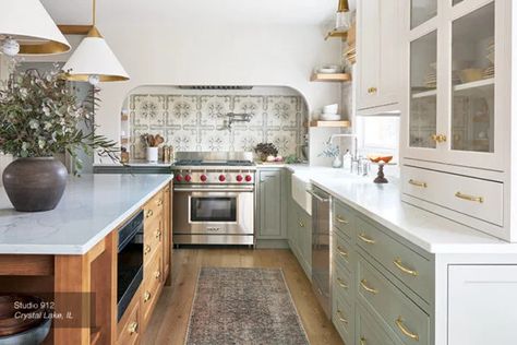 Three-Tone Kitchen Cabinets with Island - StarMark Cabinetry Three Tone Kitchen, Three Tone Kitchen Cabinets, Rejuvenation Kitchen, Soft Green Kitchen, Yellow Cabinets, Kitchen Island Cabinets, Tudor Revival, Wood Kitchen Island, Dining Nook