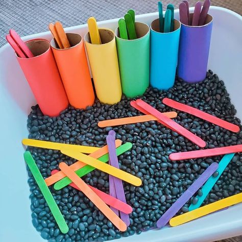 Colours Sensory Bin, Rainbow Theme Sensory Bin, Friends Sensory Bin, Simple Sensory Bin Ideas, Rainbow Preschool Sensory Bin, March Sensory Bins For Preschool, Non Toxic Sensory Bin, Quick Sensory Bin Ideas, Color Matching Popsicle Sticks