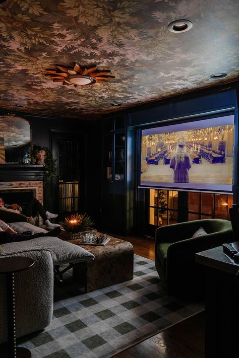 How to design the perfect small home theater setup with flexible media room seating, storage, lighting, and decor for a cozy space to spend family time. Moody Basement Theater, Blue Theatre Room, Home Theater And Library, Media Room Recliners, Media Room Aesthetic, Game Room/theater Room, Family Theater Room, Cosy Media Room, Basement Cinema Room Small