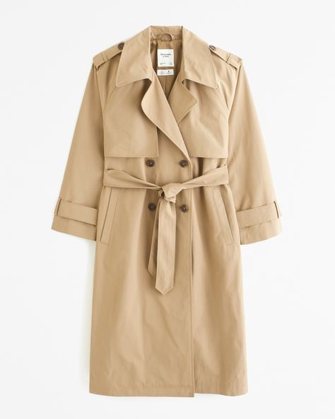 Our new elevated trench coat in our wind- and water-resistant nylon fabric and improved classic-fit silhouette, featuring luxe interior lining, double-breasted collar, side pockets and adjustable tie at waist. We updated our best-selling trench silhouette for a more true-to-size fit! Imported. What To Wear In New York, Trench Coats Women Long, Travel Capsule Wardrobe, Luxe Interiors, Long Trench Coat, Trench Coats Women, Pantalon Large, Tapered Pants, Nylon Fabric