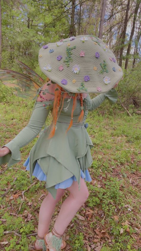 This Meadow Mushroom hat would be an extra whimsical addition to any fairy wardrobe! Decorated with flowers, clovers, and a bit of hanging ivy. (All hand crochet) It captures the essence of spring! Head Circumference: 21 1/2 inches Cap Diameter: 19 inches Mushroom Hat Reference, Crochet Whimsical Hat, Whimsical Cottagecore Outfits, Mushroom Aesthetic Outfit, Mushroom Dresses, Mushroom Fairy Costume, Crochet Mushroom Hat, Mushroom Clothes, Fairy Wardrobe