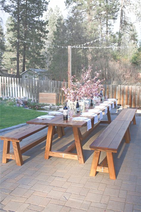 This Pinterest worthy outdoor table was constructed in two days, and took another three days total to sand, stain, and poly. It's the perfect outdoor wooden table. This pine table sits 16 comfortable on the sides, with another 2 possible at each end, for a total of 20 people! Considering all our outdoor gatherings, it's the perfect outdoor accessory. Outdoor Wooden Table, Outdoor Dining Table Diy, Outdoor Farmhouse Table, Wooden Outdoor Table, Outdoor Dinner Table, Outdoor Wood Table, Backyard Table, Wooden Garden Table, Table Picnic